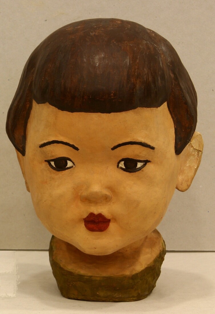Hand-coloured ceramic head of girl